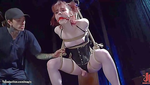 Slutty red-haired babe gets into a hardcore bondage gagging