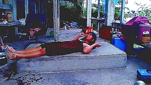 Asian girl is alone in the garden when she needs help