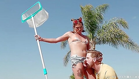 Blonde in a pool is giving a great blowjob to a large dick